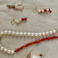Collier vintage transformé: perles de culture montées sur fil de soie orangé, et corail naturel
